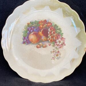 Decorative Fruit Plate with gold trim and 1846 stamp on back .